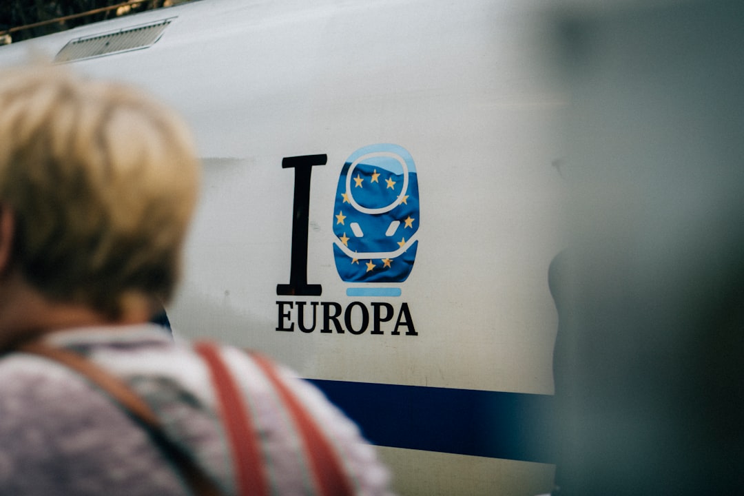 a woman standing in front of a train
