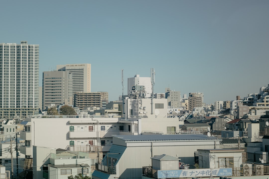 white concrete buildings under blue sky during daytime